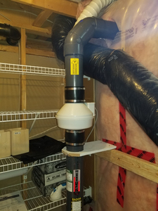 This is a picture of a residential radon mitigation system.